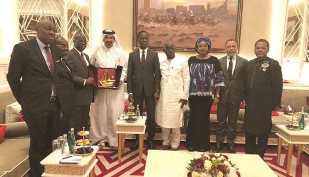 Qatar Chamber official vice chairman Mohamed bin Towar al-Kuwari hands over a token of recognition to Republic of Cote du2019Ivoireu2019s State Secretary to the Prime Minister in charge of Private Investment Promotion, Emmanuel Essis in the presence of Chamber of Commerce of Ivory Coast chairman Faman Tourih and other dignitaries.
