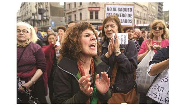 Retirees protest outside the National Congress in Buenos Aires yesterday against the governmentu2019s agreement with the International Monetary Fund (IMF) and in demand for a raise in their pensions.