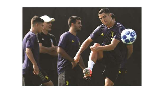 Juventusu2019 Portuguese forward Cristiano Ronaldo kicks the ball during a training session in Turin, on the eve of his teamu2019s Champions League group stage match against Valencia.