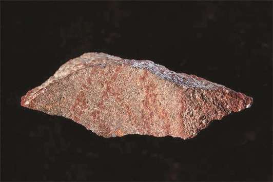 FIND: The Blombos Cave drawing with ochre pencil on silcrete stone. Scientists say itu2019s the oldest known example of a drawing made by humans.