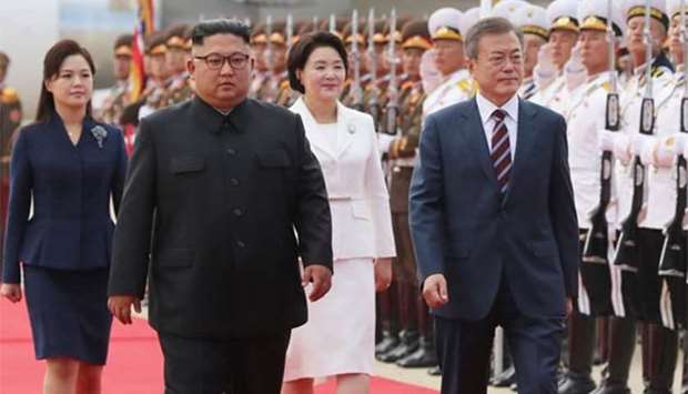 South Korean President Moon Jae-in and North Korean leader Kim Jong Un attend an official welcome ceremony at Pyongyang Sunan International Airport on Tuesday.