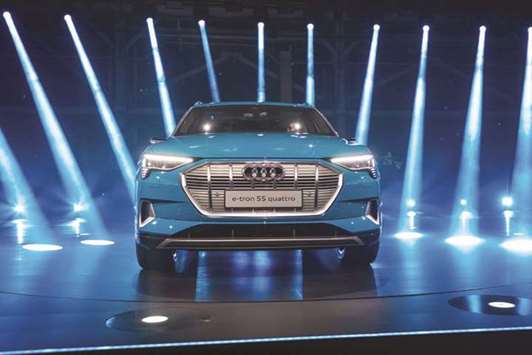 The new Audi e-tron all-electric SUV stands during the launch event in Richmond, California, yesterday. The e-tron will be offered in the United States next year at a starting price of $75,795 before a $7,500 tax credit.