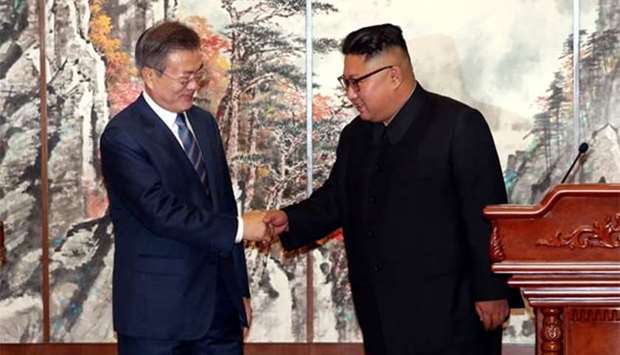 South Korean President Moon Jae-in shakes hands with North Korean leader Kim Jong Un during a joint news conference in Pyongyang on Wednesday.