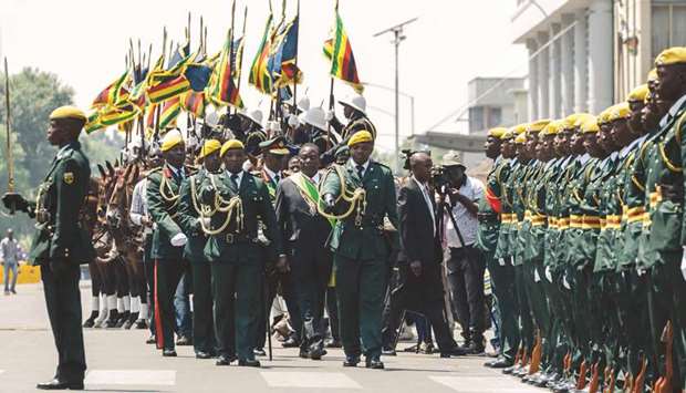 Zimbabweu2019s President Emmerson Mnangagwa reviews the guard of honour ahead of his inaugural address at the parliament in Harare.