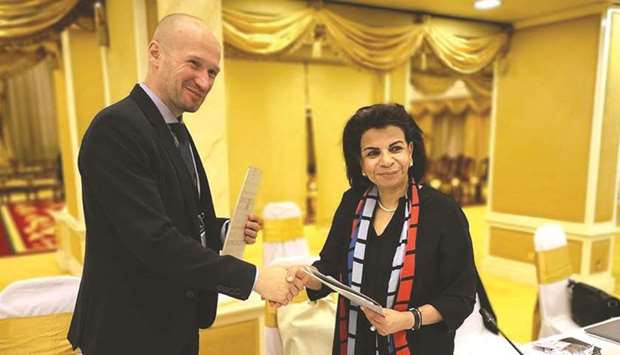 Dr Sohair Wastawy and Valentin Sidorin shake hands after signing the MoU.