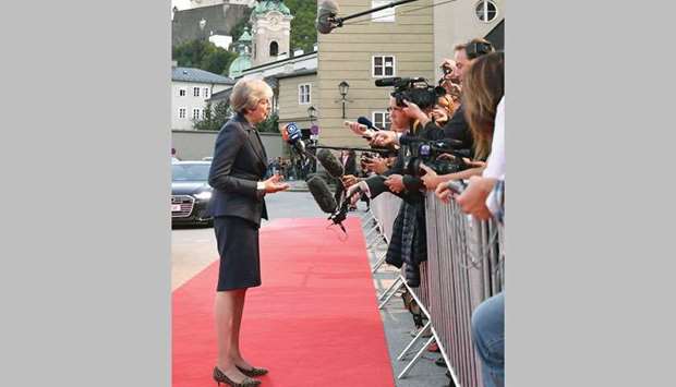 Prime Minister Theresa May speaks to journalists as she arrives at the Felsenreitschule prior to their informal dinner as part of the EU informal summit of heads of state or government in Salzburg, Austria, yesterday.