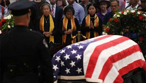 Mourners file past the casket of Senator John McCain at the US Capitol in Washington, on Friday.