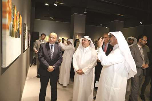 Ahmed Abdul Rahman al-Sayed and Syrian ambassador Nizar al-Haraki at the u2018We Love Lifeu2019 exhibition at Katarau2014the Cultural Village.