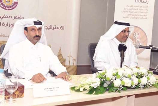 Sheikh Faleh bin Nasser al-Thani and Zafer Mohammed al-Hajri speaking at a press conference.