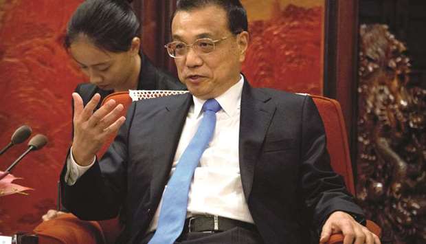 Chinese Premier Li Keqiang speaks during a meeting in Beijing. Addressing a World Economic Forum event in the port city of Tianjin yesterday, Li did not directly mention the trade conflict but said talk of Beijing deliberately weakening its currency was u201cgroundless.u201d