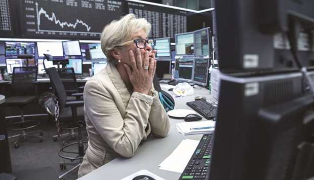 A trader monitors financial data at the Frankfurt Stock Exchange. The STOXX 600 and leading eurozone stocks both rose 0.3% to two-week highs yesterday with sentiment buoyed by hopes that the United States and China will return to the negotiating table after the latest tariff round.