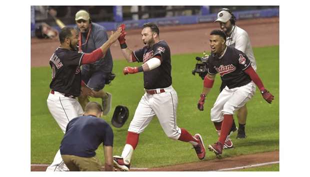 Cleveland Indians centre fielder Jason Kipnis (centre) celebrates his game-winning grand slam with teammates in the ninth inning against the Chicago White Sox at Progressive Field. PICTURE: USA TODAY Sports