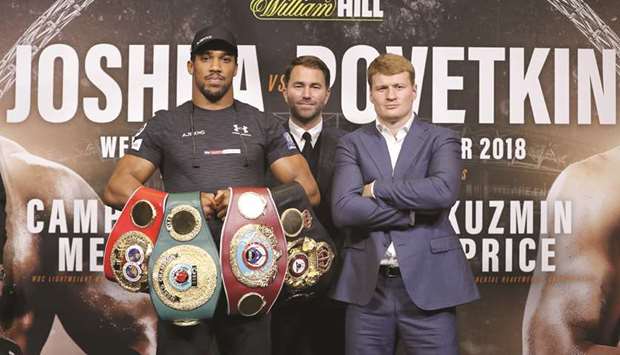 Britainu2019s Anthony Joshua (left) poses with his challenger Russiau2019s Alexander Povetkin (right) during a joint press conference at Wembley stadium in London  yesterday. (AFP)