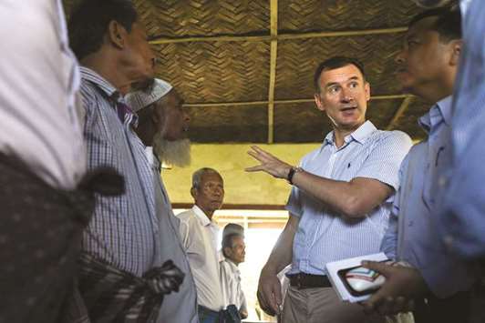 Britainu2019s Foreign Secretary Jeremy Hunt meets with local residents in Maungdaw in Rakhine state, Myanmar, yesterday.