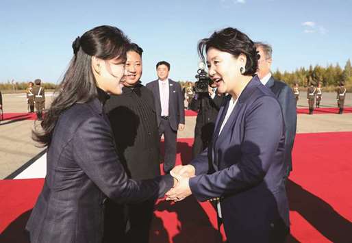 Ri Sol-ju, wife of North Koreau2019s leader Kim Jong-un, bids farewell to Kim Jung-sook (right), wife of South Korean President Moon Jae-in, on Moonu2019s departure from North Korea at Samjiyon airport yesterday.