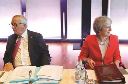 Prime Minister Theresa May and European Commission president Jean-Claude Juncker attend the European Union leaders informal summit in Salzburg, Austria, yesterday.