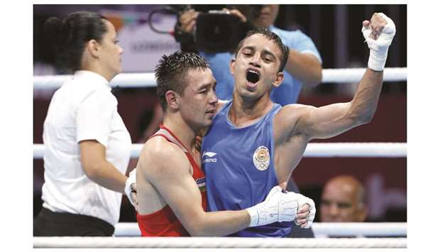 Fly (49kg) boxing final, congratulates him during the 2018 Asian Games in Jakarta, Indonesia, yesterday. (Reuters)