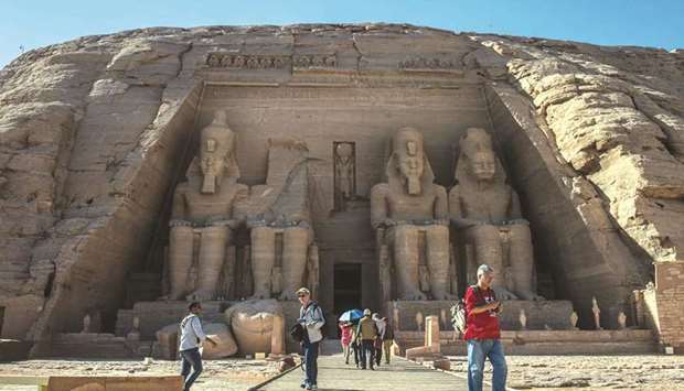 Tourists visit the Ramses II complex at the ancient Egyptian temple of Abu Simbel.