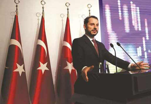Turkish Treasury and Finance Minister Berat Albayrak speaks during a presentation to announce economic policy in Istanbul on August 10. He said growth would be 3.8% this year and 2.3% in 2019, both revised down from forecasts of 5.5%.