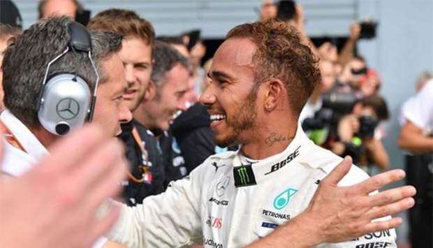 Mercedes' British driver Lewis Hamilton celebrates with teammates after winning the Italian Grand Prix in Monza on Sunday.