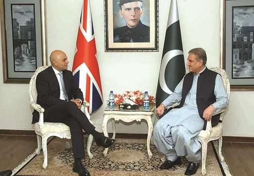 In this handout photograph released by Pakistanu2019s Press Information Department (PID) on September 17, Foreign Minister Shah Mahmood Qureshi meets visiting British Home Secretary Sajid Javid at the foreign ministry in Islamabad.