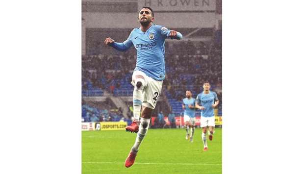 Manchester Cityu2019s Riyad Mahrez celebrates scoring their fifth goal against Cardiff yesterday.