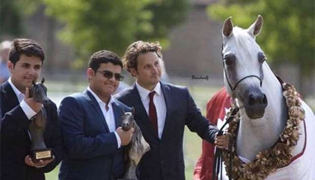 Sheikh Thamir bin Meshal bin Essa bin Thamir al-Thani (middle) and Sheikh Thani bin Meshal bin Essa bin Thamir al-Thani (left) holding the trophies after Noor Al Rayyan was adjudged Best in Show - Female at the Egyptian Event Europe horse show in Juchen, near Dusseldorf, on Sunday.