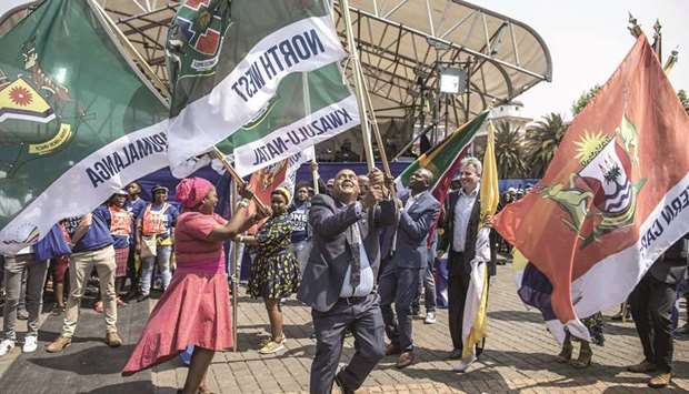 Democratic Alliance North West leader Joe McGluwa dances with a flag as Mpumalanga leader Jane Sithole and other provincial leaders join in during a rally in Johannesburg yesterday.