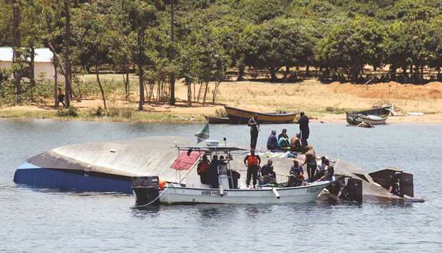 Tanzanian rescue workers search for victims on the ferry MV Nyerere in Lake Victoria.