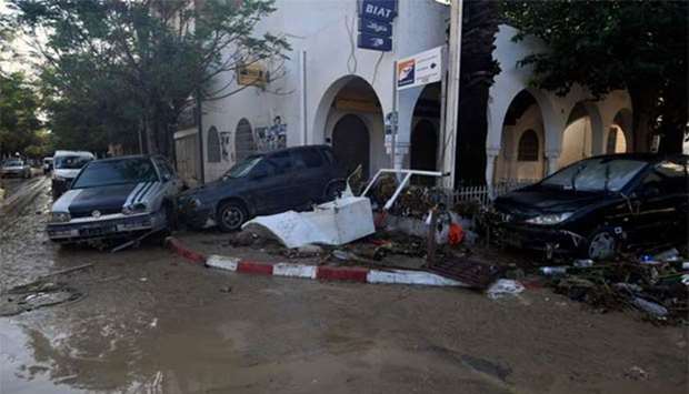 Cars washed away by flash floods are seen in the Tunisian coastal town of Nabeul.
