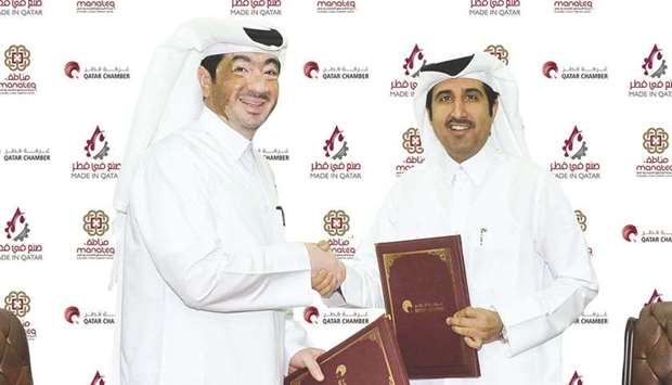 Qatar Chamber director-general Saleh bin Hamad al-Sharqi and Manateq CEO Fahad Rashid al-Kaabi shaking hands after signing the sponsorship agreement at the Chamberu2019s headquarters in Doha.