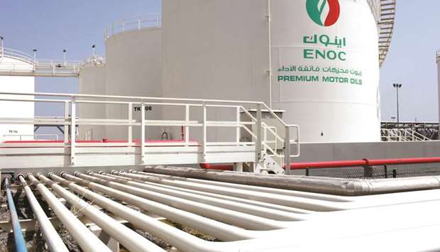 An ENOC-branded storage tank containing u201cpremium motor oilsu201d stands near pipework at the Emirates National Oil Co lubricants and grease manufacturing plant in Fujairah (file). While the ship-borne storage will help ENOC ensure an immediate supply of jet fuel for Dubai International Airport, the stockpiling also highlights ENOCu2019s lack of access to Iranian condensate, an ultra-light crude oil, used to produce jet fuel.