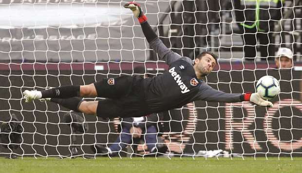 West Ham goalkeeper Lukasz Fabianski makes a save against Chelsea yesterday. (Reuters)