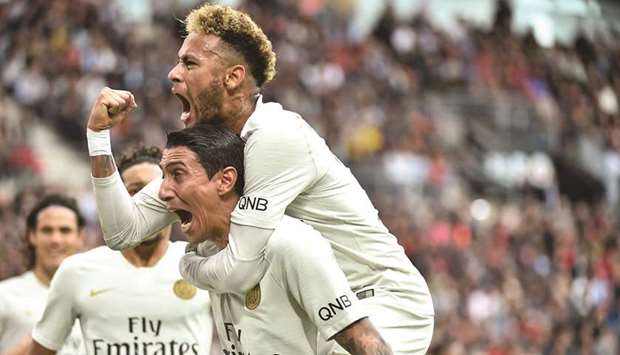 Paris Saint-Germainu2019s Angel Di Maria (left) celebrates with Neymar after scoring against Rennes in the French Ligue at the Roazhon Park stadium in Rennes. (AFP)