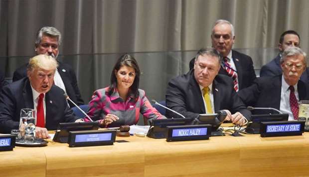 US President Donald Trump (L)talks as US Ambassador Nikki Haley (2nd L), US Secretary of State Mike Pompeo (2nd R) and US national security adviser John Bolton (R) listen at the start of the Global Call To Action On The World Drug Problem at the United Nations in New York
