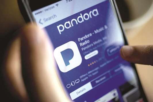 The Pandora Media application is seen in the App Store on an iPhone. Pandora has been trying to mark its position in online music industry where competitors are routinely adding new features, giving away discounts and offering more content, including interviews with popular musicians.