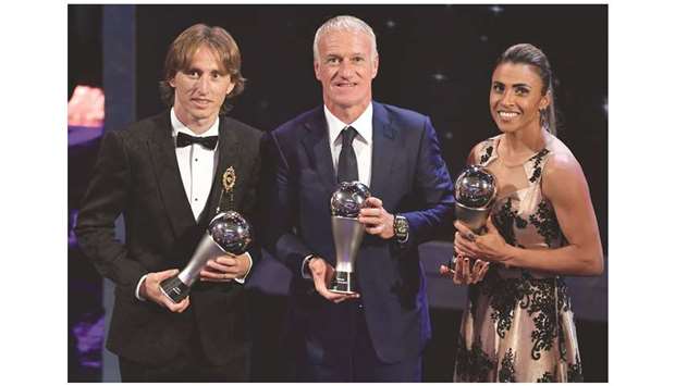 Franceu2019s coach Didier Deschamps (C), winner of the Best FIFA Menu2019s Coach of 2018 Award, is flanked by Orlando Pride and Brazil forward Marta (R), the winner of the womenu2019s best player award and Croatia midfielder Luka Modric (L) who won the menu2019s best player award.