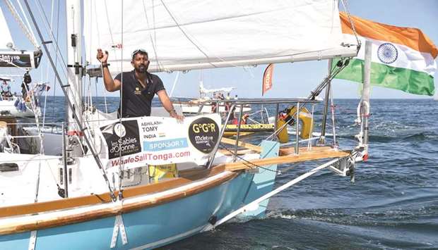 In this file photo taken on July 1, 2018 Abhilash Tomy gestures on his boat Thuriya as he sets off from Les Sables du2019Olonne Harbour at the start of the solo around-the-world u201cGolden Globe Raceu201d ocean race.