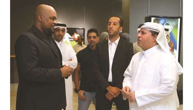 Katara deputy general manager Ahmed al-Sayed (right) speaks to photographers Yousef al-Walidi and Mohamed Ali at the event.