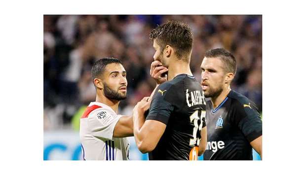 Lyonu2019s Nabil Fekir (left) clashes with Marseilleu2019s Duje Caleta-Car during the Ligue 1 match.