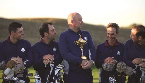 European team players Rory McIlroy (left), Francesco Molinari (second left), Thorbjorn Olesen (second right) and Sergio Garcia pose with their captain Thomas Bjorn (centre) ahead of the 42nd Ryder Cup at Le Golf National Course at Saint-Quentin-en-Yvelines, south-west of Paris yesterday. (AFP)