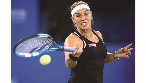 Dominika Cibulkova of Slovakia hits a return against Simona Halep of Romania during their third round match of the WTA Wuhan Open in Wuhan yesterday. (AFP)
