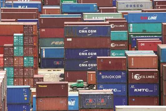 Shipping containers are seen at a port in Shanghai. The Chinese governmentu2019s top diplomat told business people at a meeting in New York that trade talks between China and the US could not take place against the backdrop of u201cthreats and pressureu201d.