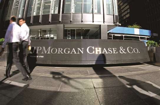 Pedestrians walk past JP Morgan headquarters in New York. JPMorgan, BlackRock and Goldman Sachs are among giants hoping to persuade EU authorities to preserve a key feature that investors have come to expect: the fixed share price.
