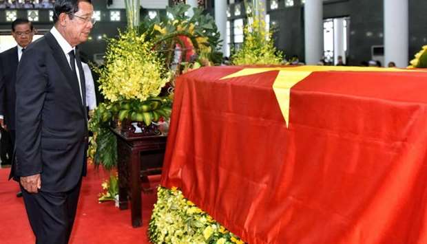 Cambodia's Prime Minister Hun Sen pays his respects infront of the coffin of late Vietnamese president Tran Dai Quang during the first day of a two-day-national mourning in Hanoi.