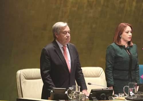 United Nations Secretary-General Antonio Guterres and General Assembly President Maria Fernanda Espinosa Garces stand for a moment of silence for former secretary general Kofi Annan during the 73rd session of the United Nations General Assembly at UN headquarters in New York.