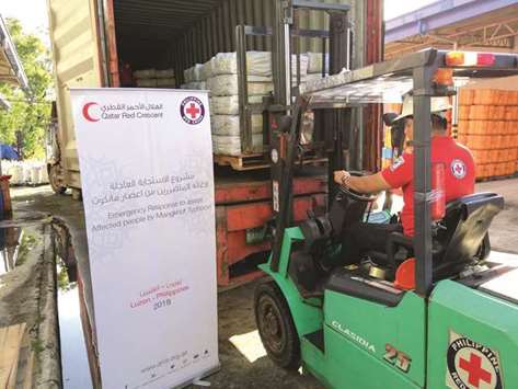 QRCS relief aid to typhoon victims in the Philippines being delivered to warehouses.