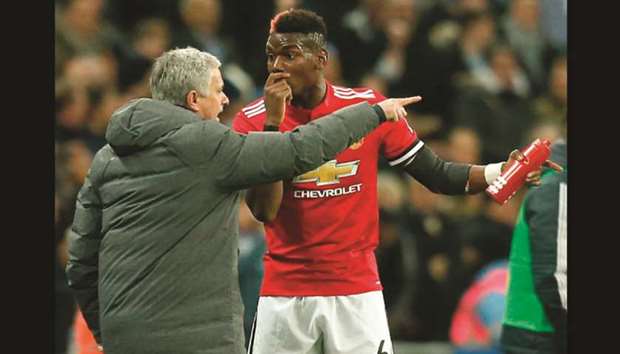 Manchester United manager Jose Mourinho (left) and midfielder Paul Pogba had a frosty exchange during a training session. (AFP)