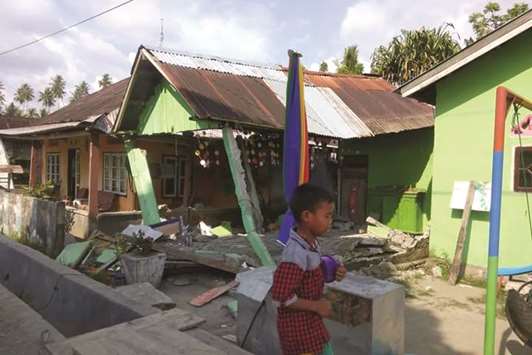 A collapsed house following an earthquake in Donggala, Central Sulawesi.