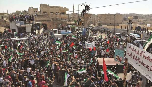 Syrians demonstrate against the government in the rebel-held town of Maaret al-Numan, in the north of Idlib province, yesterday.
